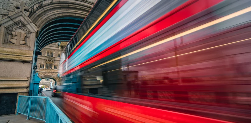 Bus moving fast on road