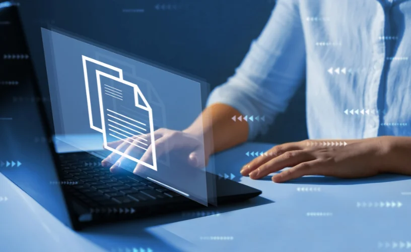 Businesswoman working on laptop with virtual screen