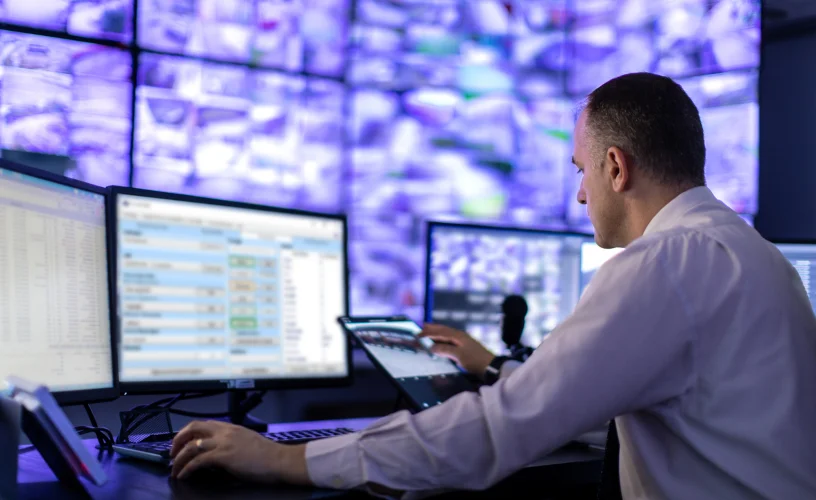 Man working in a control room environment